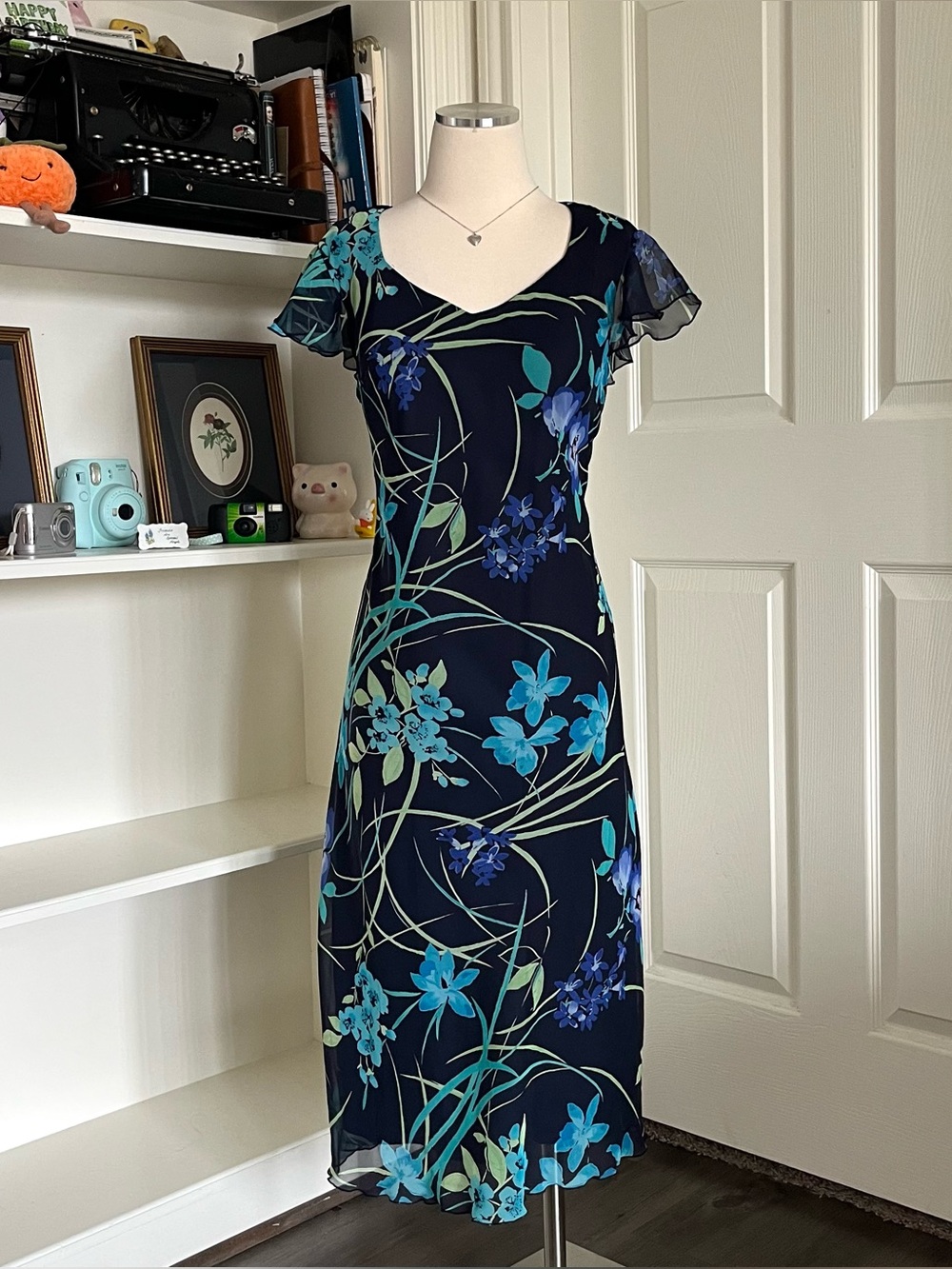 90s blue floral midi dress with ruffle sleeves and V-neckline.